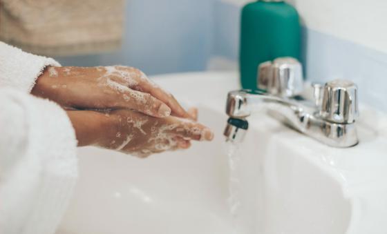 person washing their hands